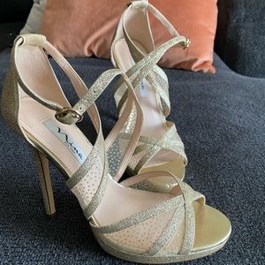 Gold high heel shoes